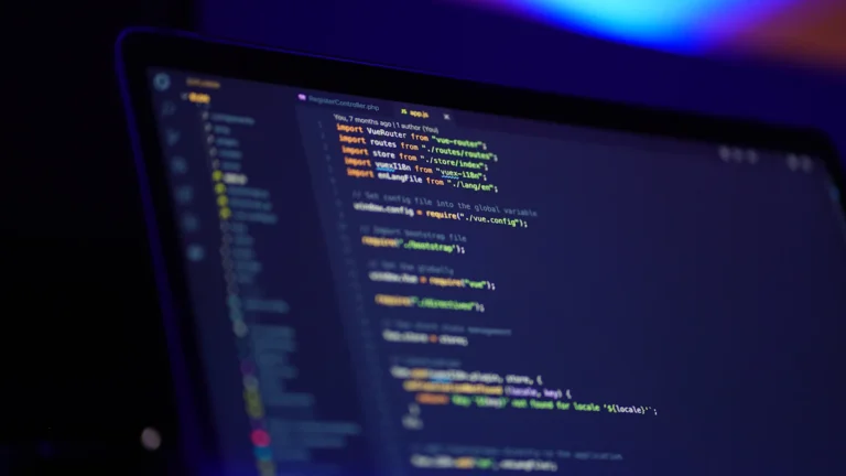Laptop screen showing colourful website code